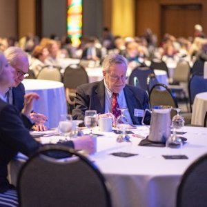 This is a photo of Connecticut Health Foundation board members sitting at a round table in a ballroom during an event.