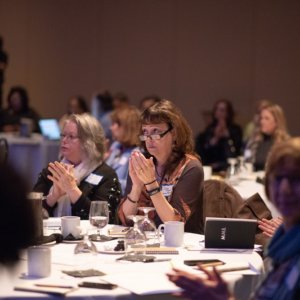 This is a picture of women sitting at a round table and listening to a speaker during the Connecticut Health Foundation's 2018 thought event.