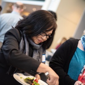 This is a photo of Theanvy Kuoch getting a salad at a buffet during the Connecticut Health Foundation's 2018 thought event.