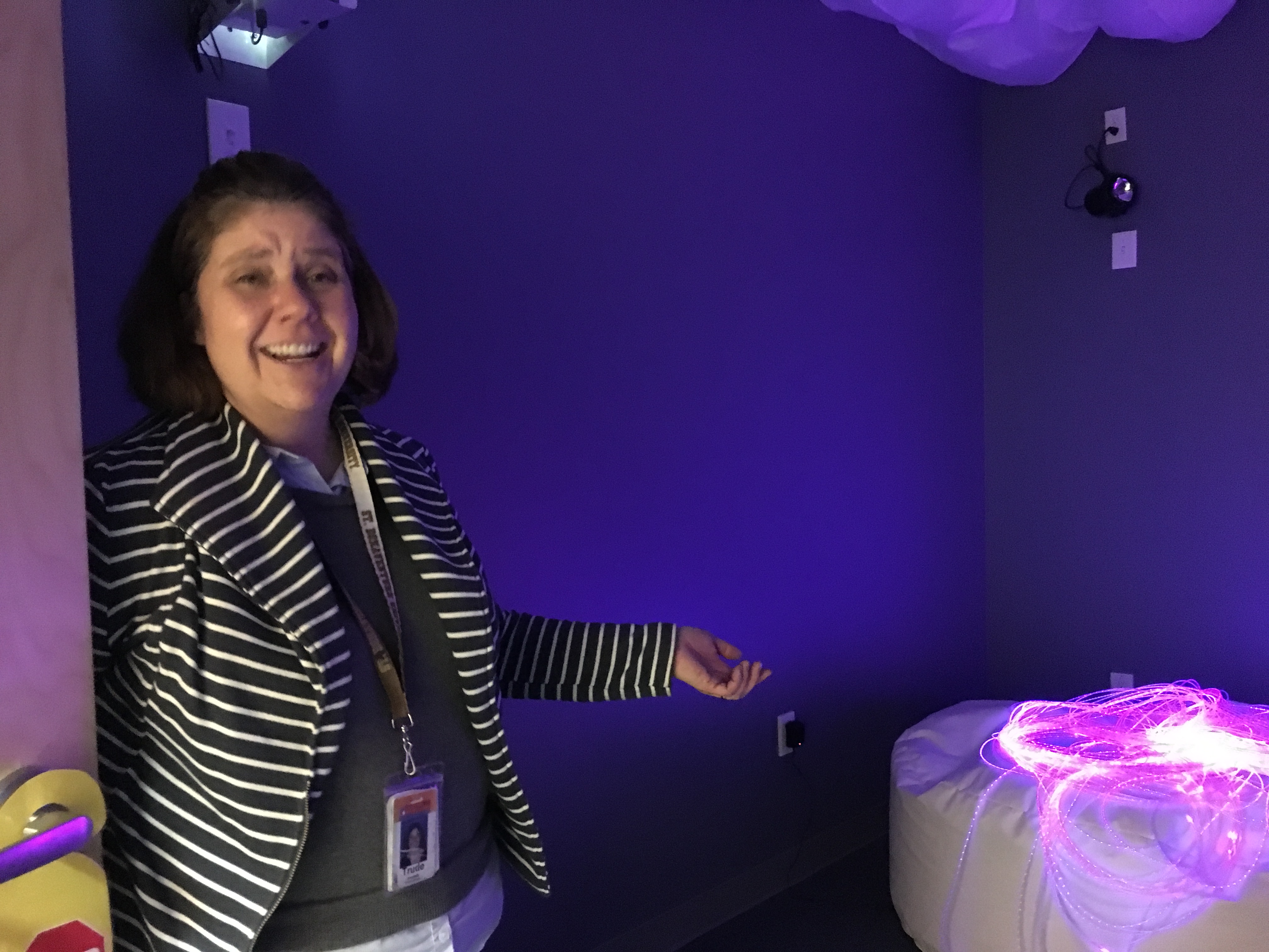 The room contains a variety of items, including a sound machine, bubble machine, and special lights, that can be used to help clients focus or transition between activities.
