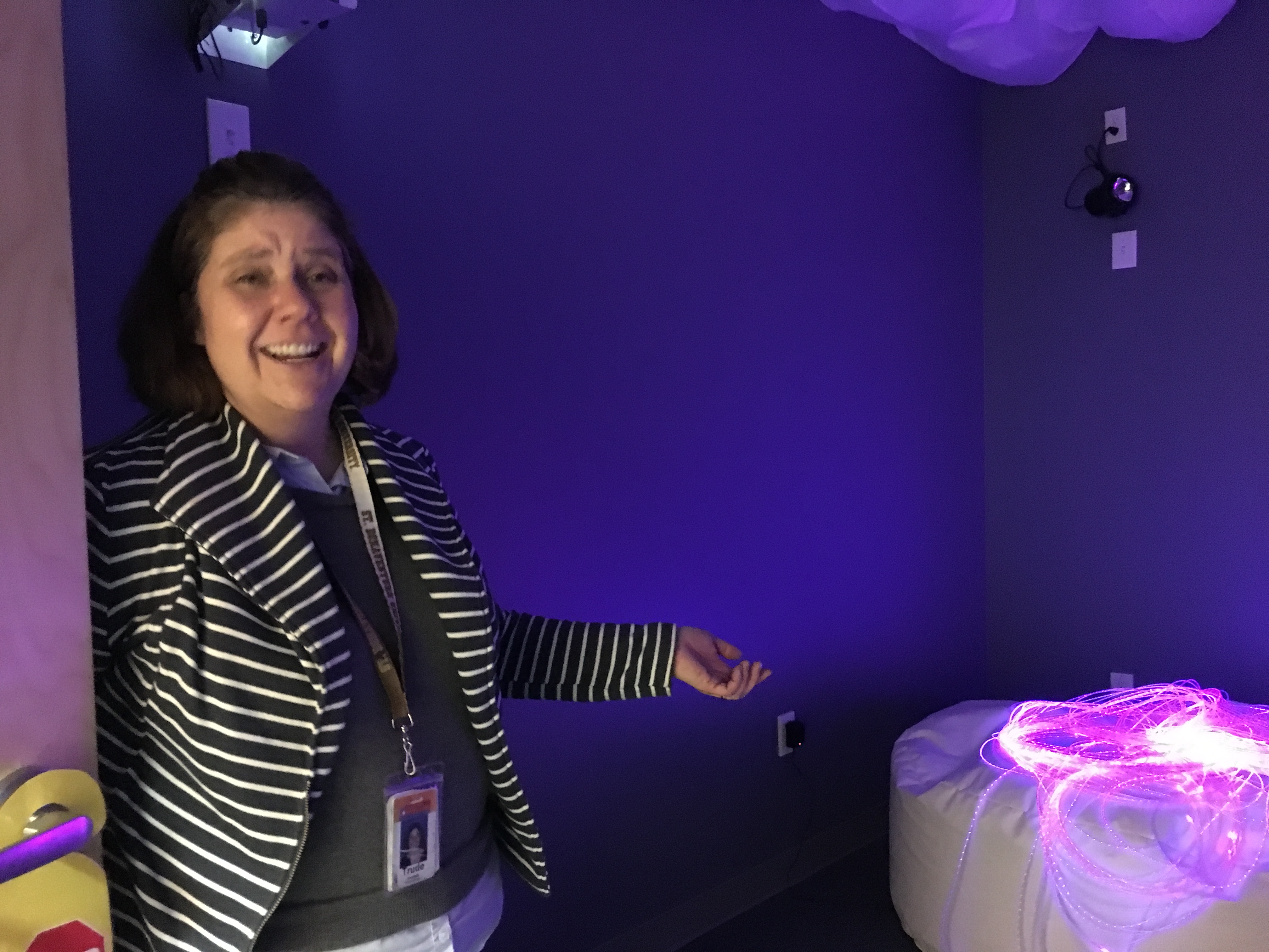 The room contains a variety of items, including a sound machine, bubble machine, and special lights, that can be used to help clients focus or transition between activities. 