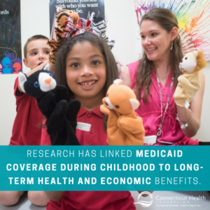 This is a graphic that shows a photo of two children and a teacher playing with puppets, with text over the picture that says research has linked Medicaid coverage during childhood to long-term health and economic benefits.