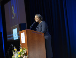 Tiffany Donelson speaking at a podium